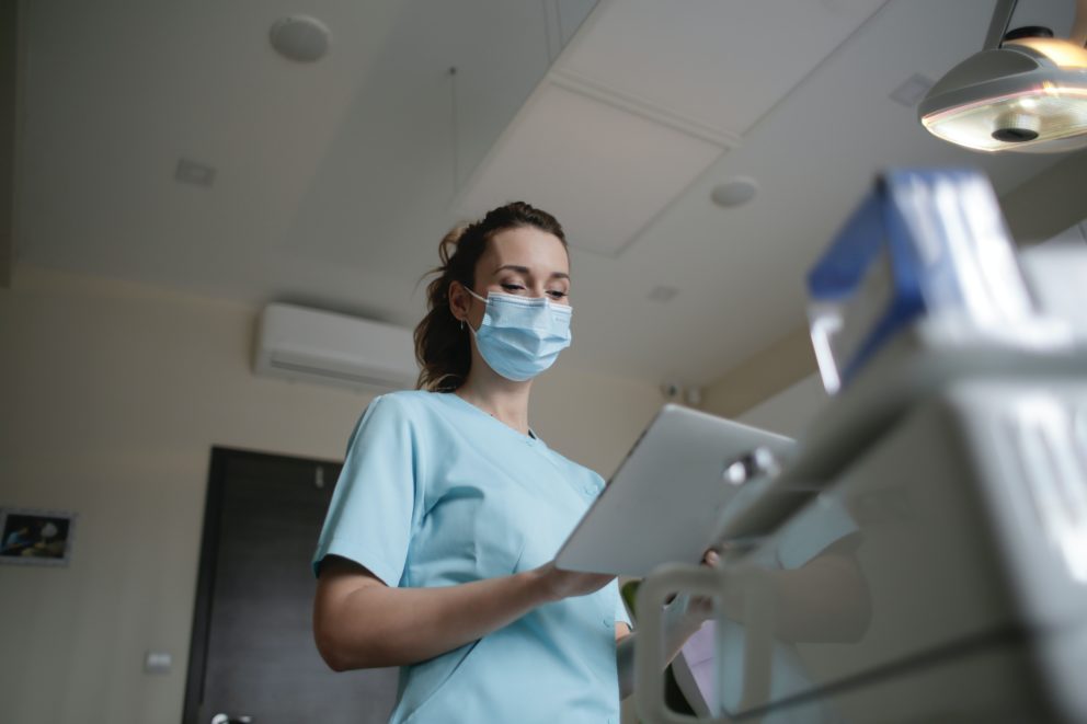 female doctor checking mammography on ipad