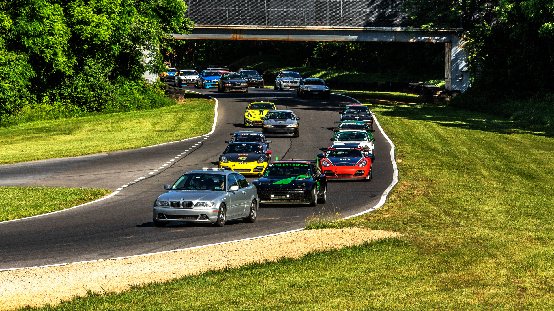 Busy Guys yellow racecar among other racecars