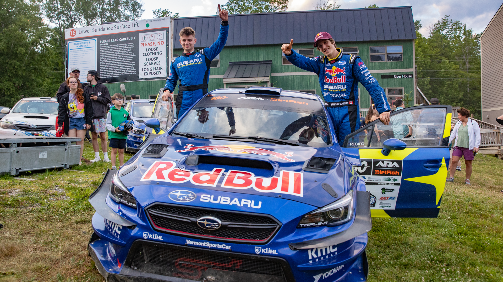 Subaru team posing with the racecar